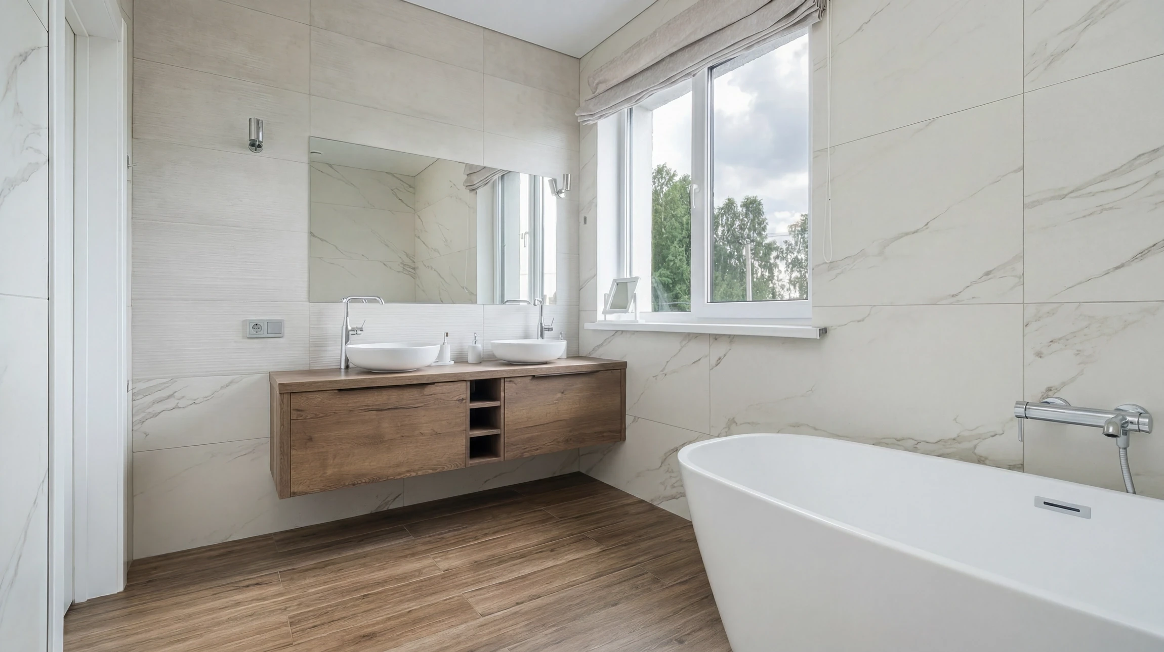 Plombier professionnel en uniforme noir avec ceinture à outils installant ou réparant une robinetterie noire moderne au-dessus d'un lavabo vasque blanc